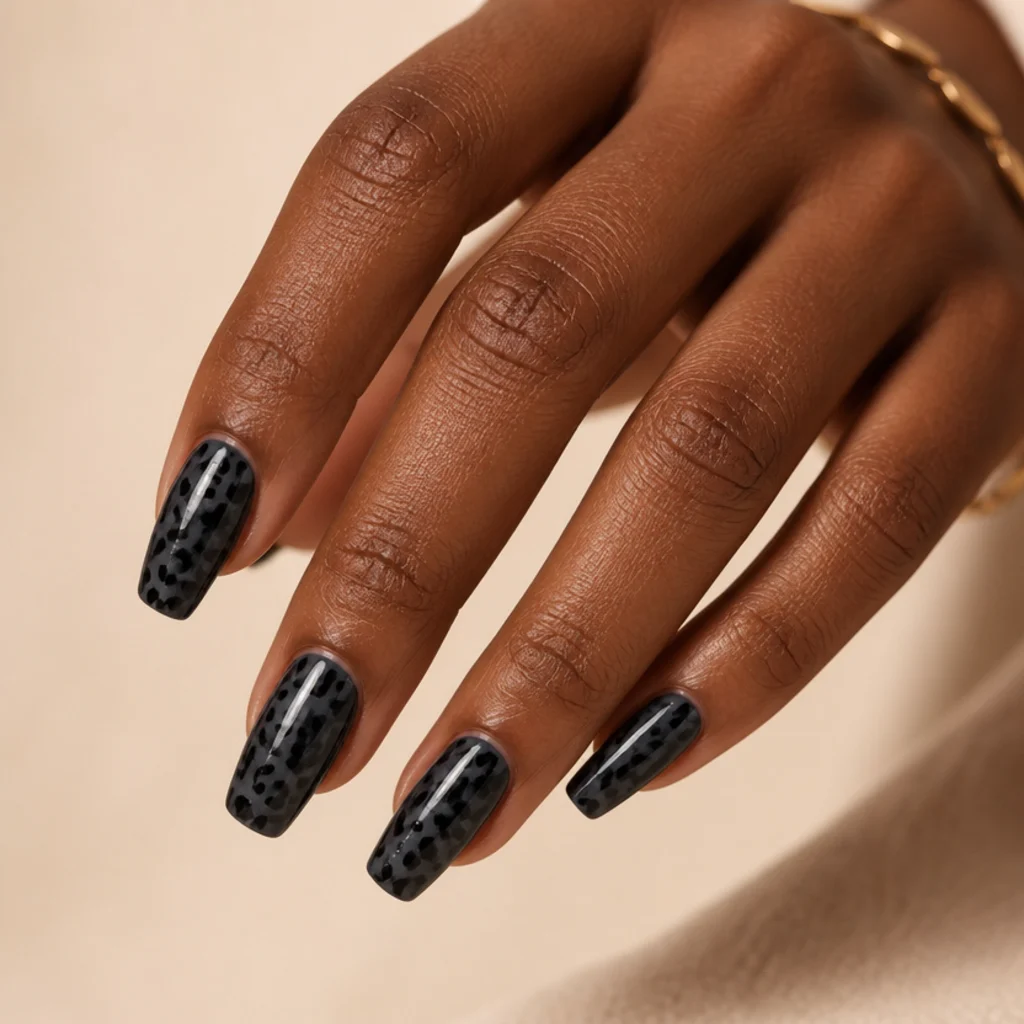 Coffin nails in soft charcoal gray with darker black tonal leopard spots and a subtle shine