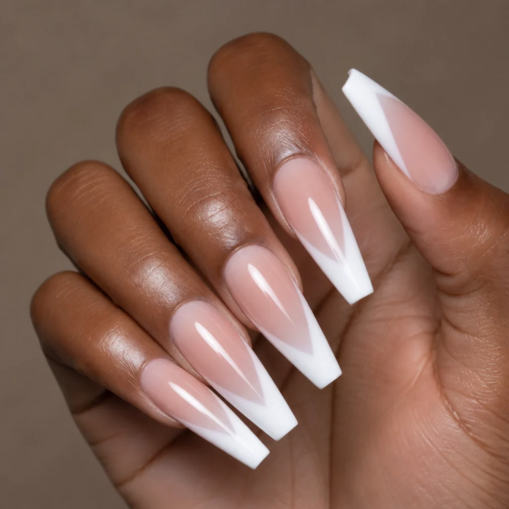 Long coffin nails with an angled V-shaped white blooming gel french tip