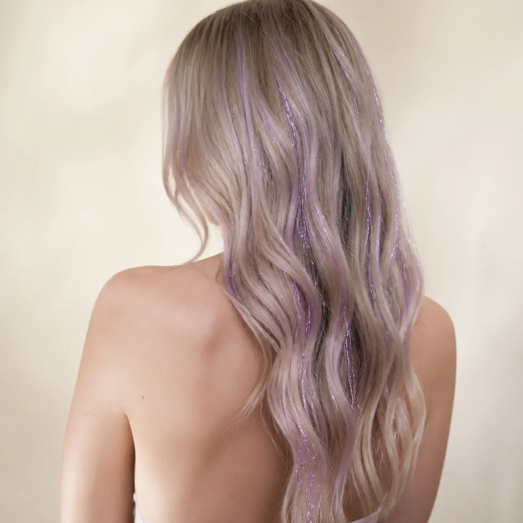 Back view of cool-blonde hair with soft lavender tinsel adding a pastel violet sheen