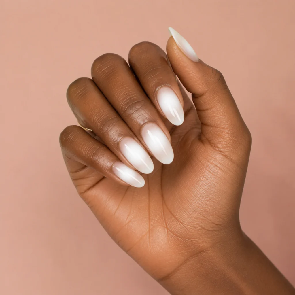 Almond nails with a centered white aura of blooming gel glowing from the middle of each nail